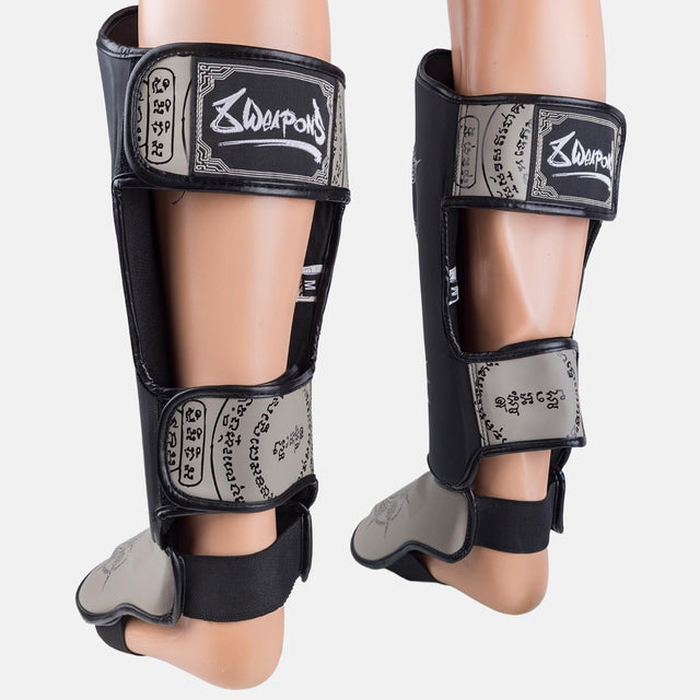 8 WEAPONS Shin guards 8 Ways Yant – Black/Sand