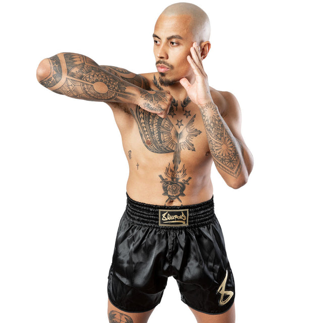 8 WEAPONS Muay Thai Shorts Strike – Black/Gold