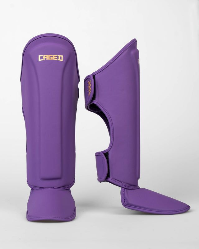 Caged Spark Kids Shin Guards – Purple/Gold