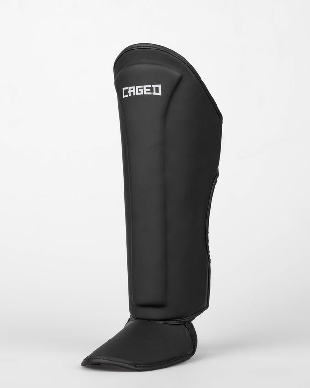 Caged Spark Kids Shin Guards – Matte Black/White