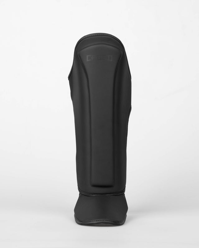 Caged Spark Kids Shin Guards – Matte Black