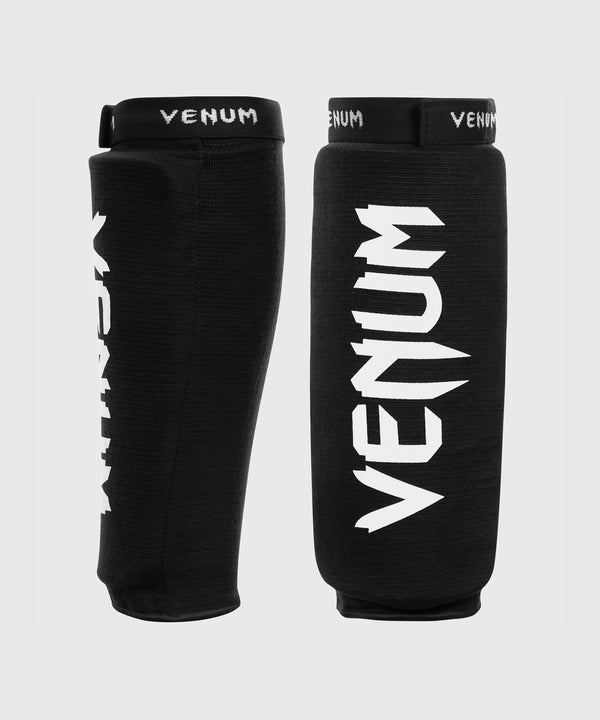 Espinilleras Venum Kontact sin pie – Negro/Blanco