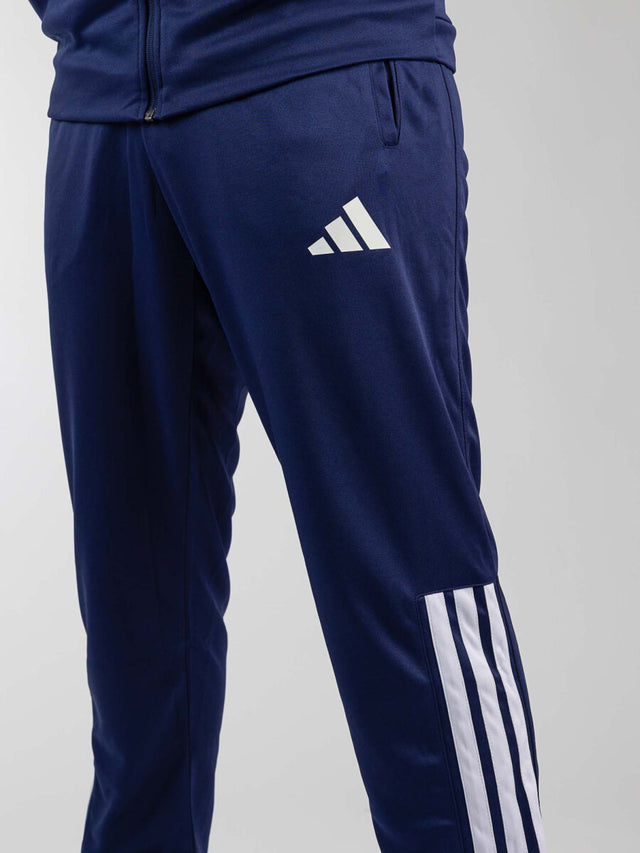 Tepláky Adidas Community Sports – Tmavě modrá/Bílá