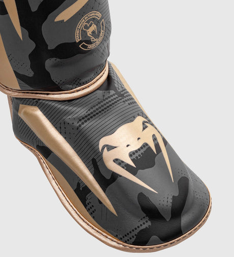 Venum Schienbeinschoner Elite – Camo Grau/Gold – Schienbeinschoner